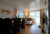 HTI | 3-Zimmer-Wohnung mit großer Sonnenterrasse und Talblick - Wohn-Esszimmer