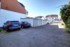 HTI | Attraktive, vermietete Dachgeschosswohnung in Feldrandlage von Liederbach - Garagenhof mit Stellplatz (links)