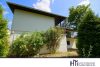 HTI | Großzügiger Winkelbungalow mit idyllischem Garten in Eppstein-Vockenhausen - Hausansicht Garten