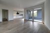 HTI | Neubau Erstbezug - Moderne Ausstattung, Wallbox, Parkplatz, Einbauküche - fantastischer Blick über Oberursel inklusive! - Wohnzimmer